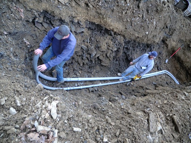 Installing Conduit for Electrical and Cable service.